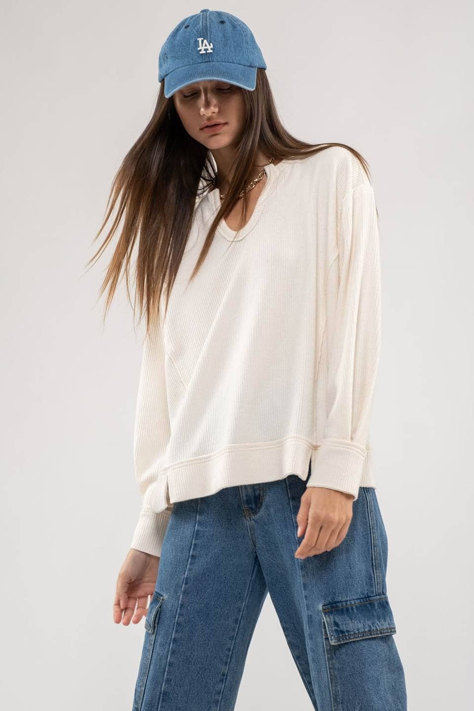 RAW EDGE SPLIT NECK AND HEM RIB KNIT TOP